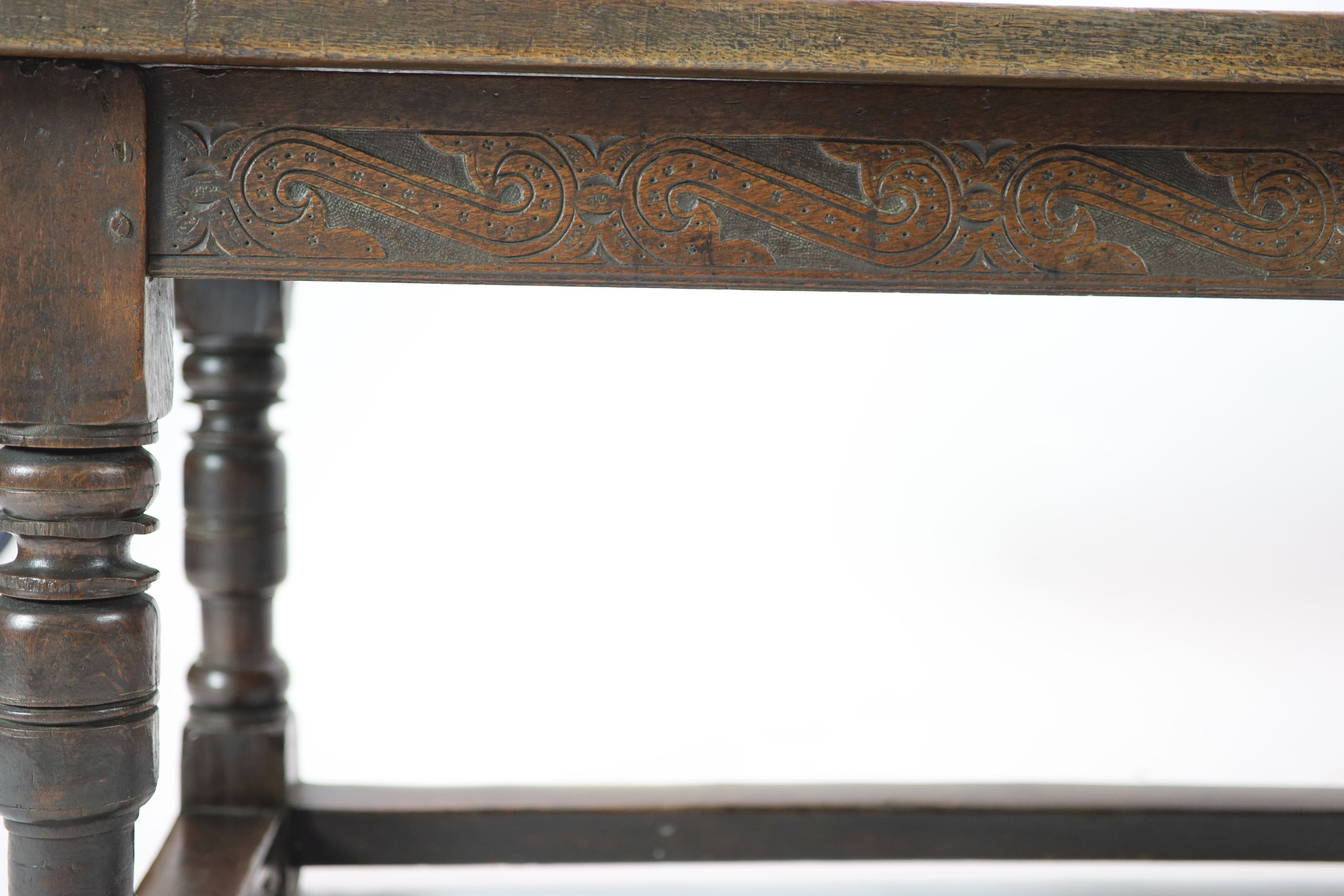 A Charles I oak refectory table, possibly West Country, having three-plank top H 74cm. W 220cm. D 76cm.